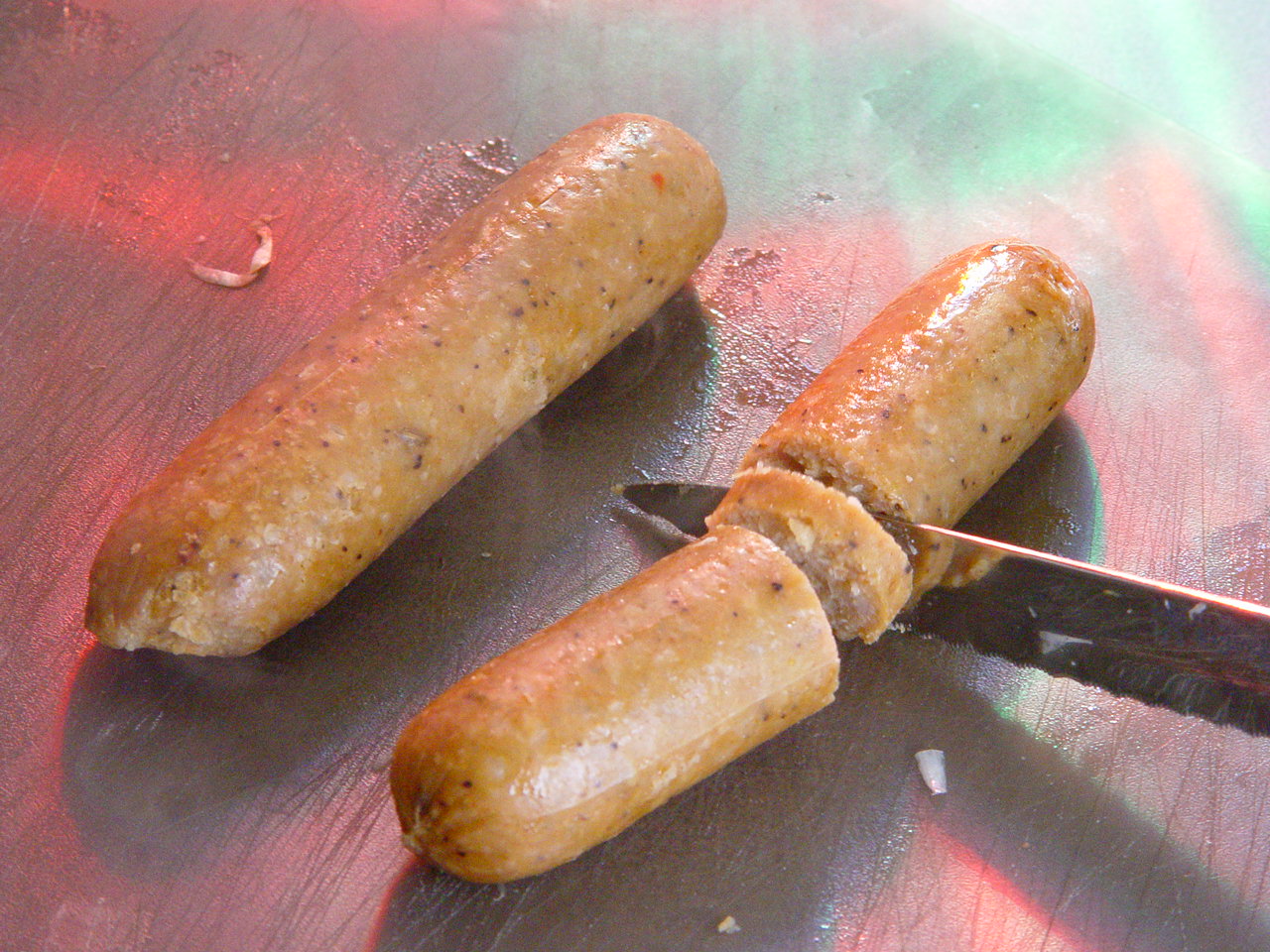 Making vegetarian sausage and peppers