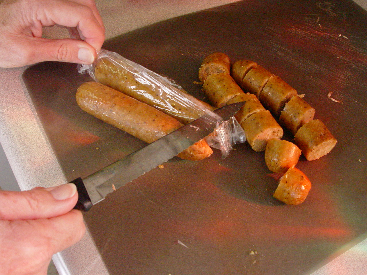 Making vegetarian sausage and peppers