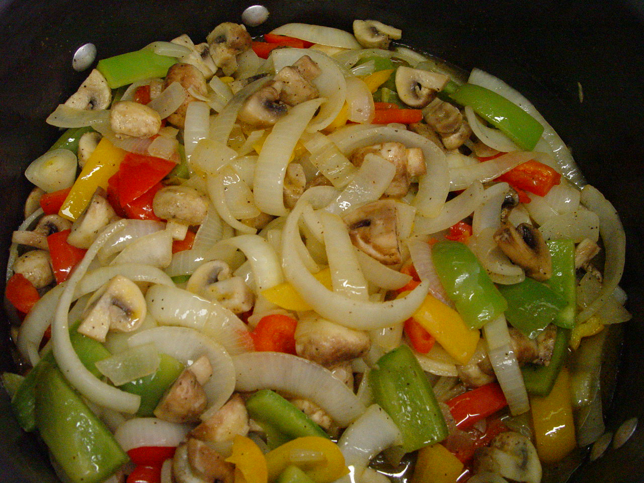 Making vegetarian sausage and peppers