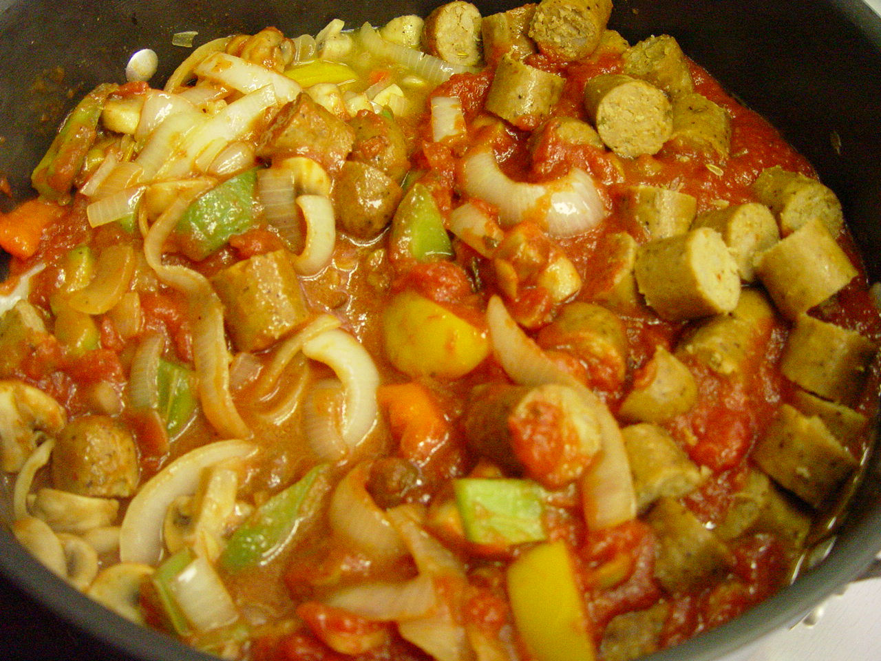 Making vegetarian sausage and peppers