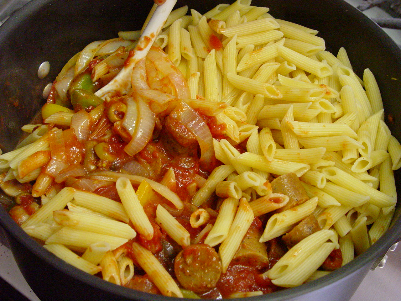 Making vegetarian sausage and peppers