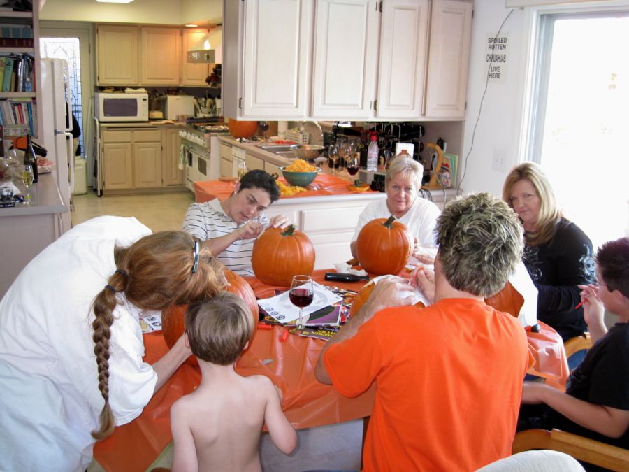 Carving the pumpkins with family at the Liles home