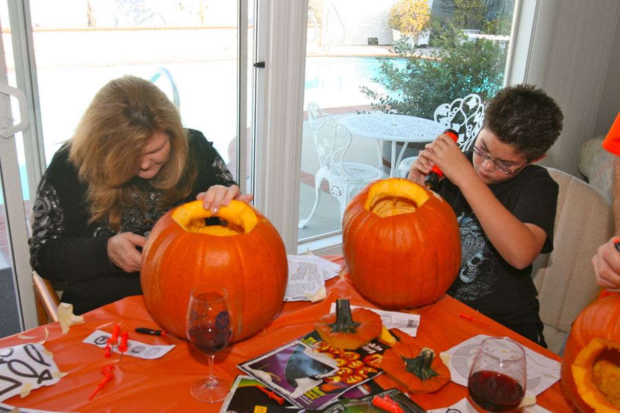 Carving the pumpkins with family at the Liles home